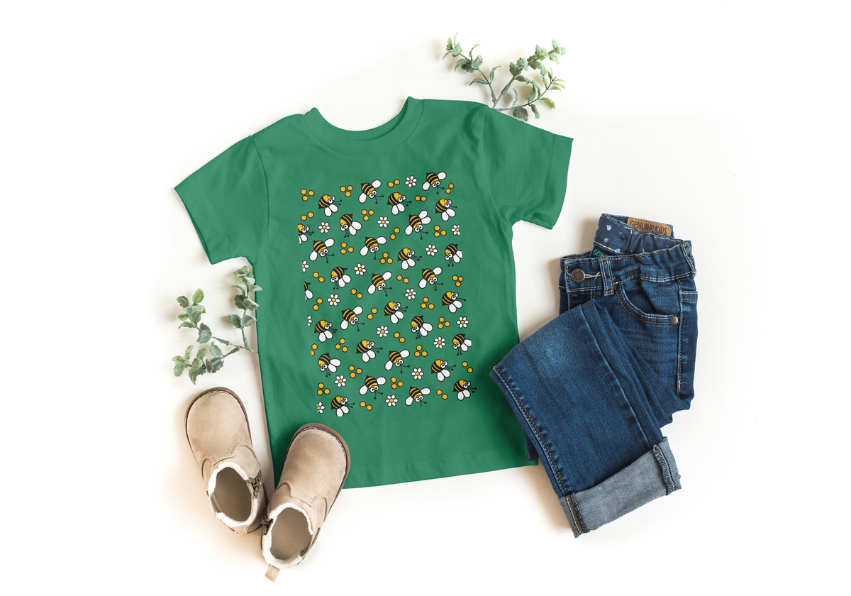 Knorr green kids t-shirt with all-over flying bees and daisy print, styled with jeans and boots - Marfz.pk