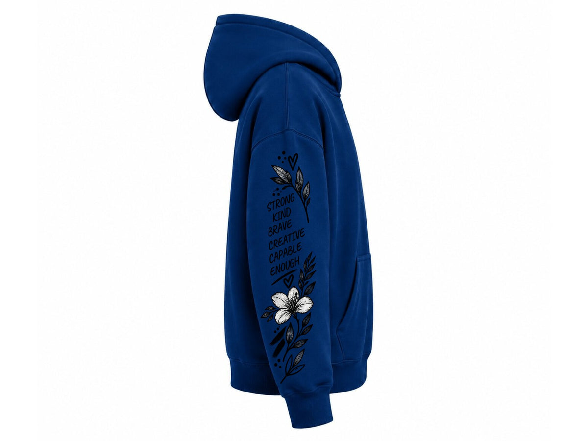 A royal blue pullover hoodie shown from the side profile on a plain white background. The right sleeve features a graphic print with a white flower, dark blue leaves, and vertical text that reads 'STRIKE DOWN ALL THOSE WHO WANT TO STOP YOU'.