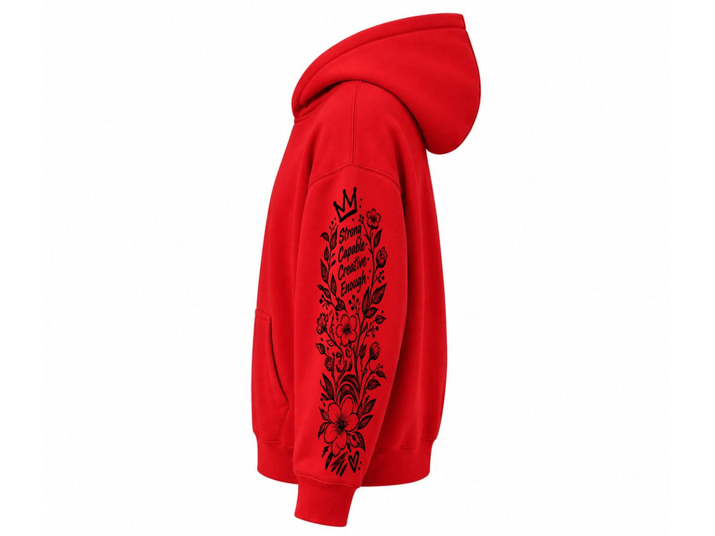 A bright red pullover hoodie shown from the side profile, featuring a black floral graphic and the text 'I Still Love You' printed down the sleeve, set against a plain white background.